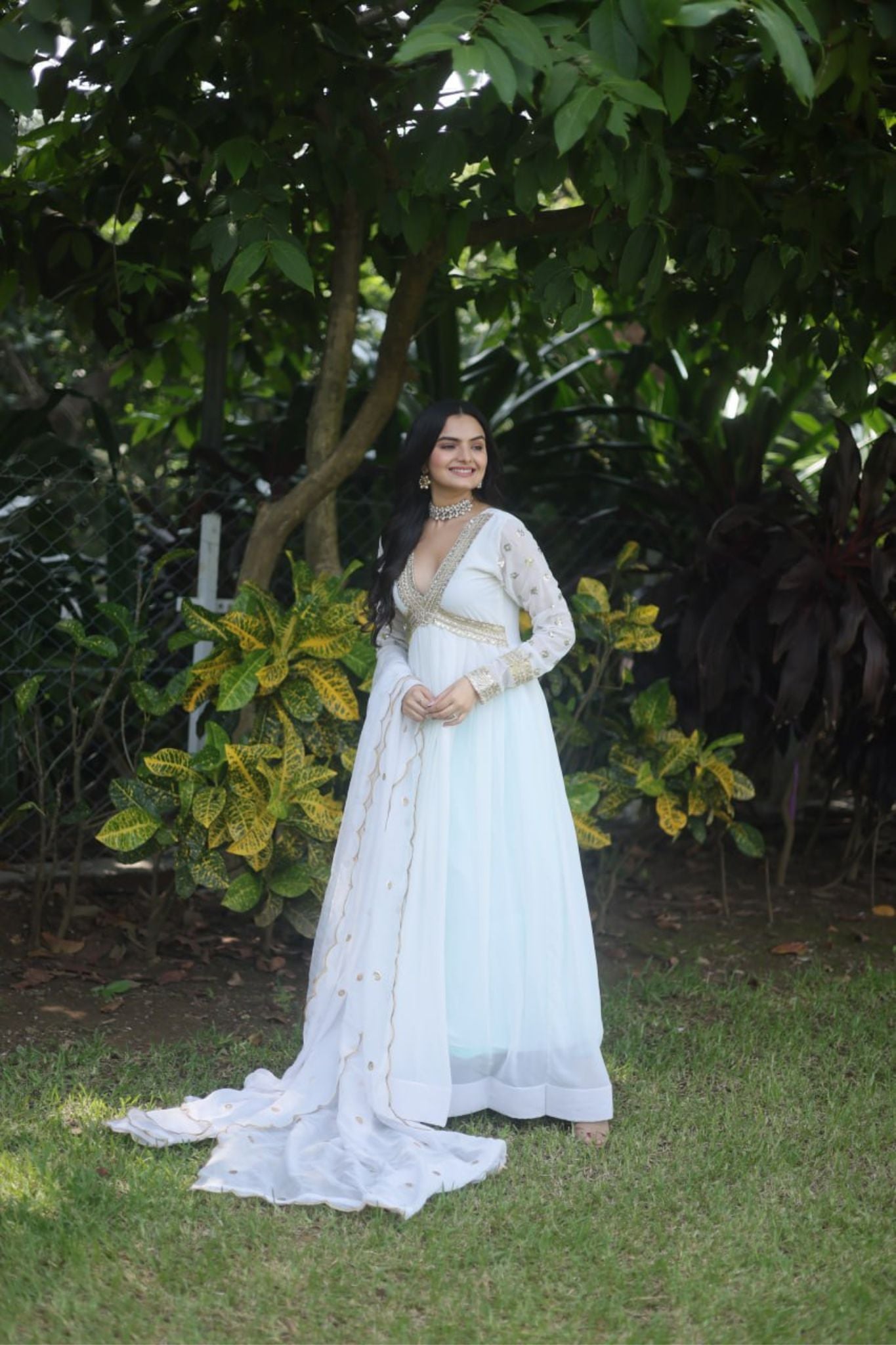 Embroidered Gown with Golden Accents and Flowing Dupatta